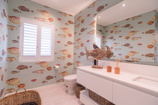 Commercial photography - interiors. Bathroom with fish-themed wallpaper in a Langebaan holiday home